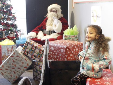 Samira Tahir poses with Santa Claus for a portrait in Downtown Timmins on Saturday. The downtown Business Improvement Association has been hosting a weekly pop-up shops which includes family photo shoots with Santa. Two more pop-up shops will be held on Dec. 12 and 19, from 10 a.m. to 4 p.m.

RICHA BHOSALE/The Daily Press