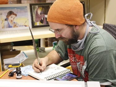 Quinn Lockman, a local artist, was working on a customer's art piece at the Holiday Pop-up shop hosted by the Timmins Business Improvement Association on Saturday.

RICHA BHOSALE/The Daily Press