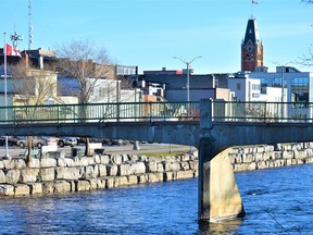 Work to demolish the existing footbridge over the Moira River connecting Catharine Street to the city's downtown is scheduled to begin next summer to make way for an entirely new bridge by 2022. DEREK BALDWIN