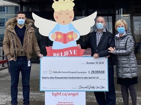 Belleville General Hospital Foundation Executive Director Steve Cook accepts a cheque for nearly $30,000 from Chris and Shirley Van Steen of Carrying Place, who had purchased stocks at a low price and decided to sell and donate the profits to BGHF. SUBMITTED PHOTO