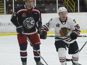 Former teammates Ben Dirven (left) and Troy Bowditch react to the play near the Cornwall net during a Colts-Braves scrimmage at the Brockville Memorial Centre in December. 
File photo/The Recorder and Times
