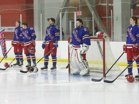 The South Grenville Rangers' starting lineup stands for the anthem before the start of the Jr. C team's final home playoff game of 2020 in March.
File photo/The Recorder and Times