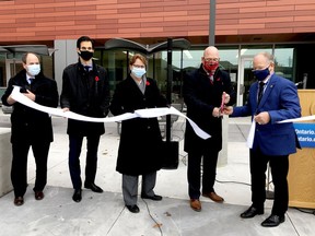 Leeds-Grenville Thousand Islands and Rideau Lakes MPP Steve Clark cuts the ribbon at the official opening of Brockville General Hospital's Donald B. Green Tower on Nov. 3 with the help of, from left, BGH president and CEO Nick Vlacholias, acting chief of medical staff Dr. Michael Fuoco, Brockville and Distrct Hospital Foundation chairwoman Marilies Rettig and Jim Cooper, chairman of the hospital's board of directors. (RONALD ZAJAC/The Recorder and Times)