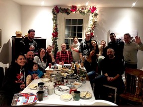 The photo that went viral, shows independent MPP Randy Hillier posing with a 14 people at a Christmas dinner at his home.  The photograph garnered a fair bit of negative response but also some positive messages. (VIA FACEBOOK)