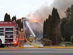 Crews are shown at the scene of a house fire on Pain Court Line near Winter Line Road on Wednesday afternoon. No injuries were reported, however, firefighters spent several hours battling the blaze. Trevor Terfloth/Chatham Daily News/Postmedia Network
