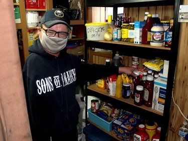 Ted Vanderlei, a volunteer at the Campbell AME Church soup kitchen, gets some supplies as the take-out meal was being prepared at the Chatham church on Wednesday. Ellwood Shreve/Chatham Daily News/Postmedia Network