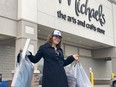 Jessica is elated as she walks out of Michaels with Christmas gifts for her son and mom thanks to donations provided to The Gift.