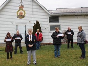 In foreground at the Iroquois Legion Monday morning is Branch 370 president Darlene Riddell. In back, from left, are Sandy Collette (representing Carefor Hospice Cornwall), Jim Wilson (Community Food Share), Sheila Holmes (Iroquois Legion), Bonnie McNairn (South Dundas Christmas Exchange), Paul Renaud (Dundas County Hospice) and Janice Pilon (South Dundas Christmas Exchange). Photo on Monday, December 14, 2020, in Iroquois, Ont. Todd Hambleton/Cornwall Standard-Freeholder/Postmedia Network