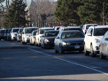 A small part of the vehicle traffic jam, cars in front of the civic complex on the way to the ChildrenÕs Christmas Fund distribution event. Photo  on Friday, Dec. 18, 2020,  in Cornwall, Ont. Todd Hambleton/Cornwall Standard-Freeholder/Postmedia Network