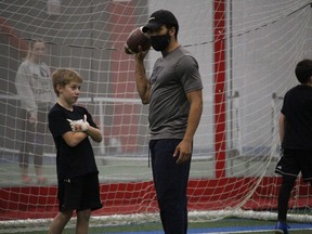 Coach Nate Behar with some instructions for Bryce Camplin at the Formula 11 Cornwall Wildcats camp. Photo on Sunday, December 20, 2020,  in Cornwall, Ont. Todd Hambleton/Cornwall Standard-Freeholder/Postmedia Network