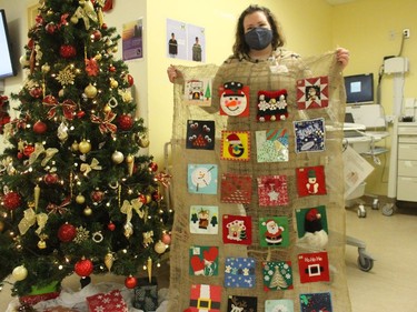 Kayla MacGillivray, the HGMH Human Resources and Patient Relations Manager, holding one of the 24 Days of Christmas displays. Photo on Tuesday, December 22, 2020, in Alexandria, Ont. Todd Hambleton/Cornwall Standard-Freeholder/Postmedia Network