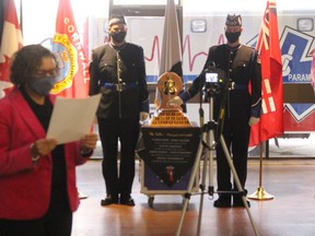 Cornwall Mayor Bernadette Clement, among the dignitaries reading the names of all paramedics fallen in the line of duty, while the Paramedic Memorial Bell is rung by Cornwall-SDG Paramedic Services  honour guard members Leighton Woods (left) and Thomas Shackleton. Photo on Wednesday, December 23, 2020, in Cornwall, Ont. Todd Hambleton/Cornwall Standard-Freeholder/Postmedia Network