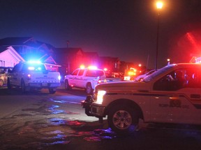 RCMP and Municipal Enforcement vehicles together during a parade through Jumping Pound on December 2, before tougher public health measures were introduced in town and across the province.