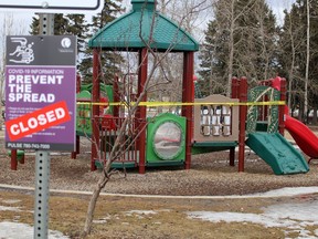Police tape closes off a playground in Beacon Hill on Sunday, April 19, 2020. Parks in the region are closed because of COVID-19 regulations. Laura Beamish/Fort McMurray Today/Postmedia Network