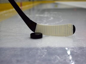Ice hockey stick with puck