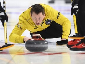 Team Manitoba skip Jason Gunnlaugson delivers while taking on Quebec at the Brier in Kingston, Ont., on Sunday, March 1, 2020. THE CANADIAN PRESS/Sean Kilpatrick