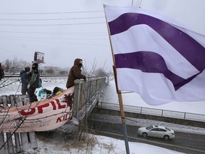 About 30 protesters occupy the rail overpass at Gardiners Road in support of the Wet'suwet'en demonstrations across the country on Feb. 27.