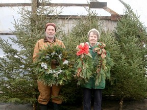 Les Cudmore and his sister Ruth Johnson have been selling Christmas trees at Cudmore Farms for the last 23 years. While they've decided this year will be their last selling the trees, they will continue selling wreaths and planters. Scott Nixon