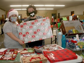 Pictured getting gift and food hampers ready on Dec. 18 for the South Huron Community Angel Project are volunteer Kathleen Binns, left, and Noah's Ark/Community Table volunteer co-ordinator Andrea Loohuizen.