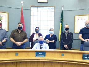 Mayor Glenn George sits with the rest of the City of Melfort's newly elected council behind him. Left to right are: Tim Hoenmans, Doug Terry, Tara Muntain, April Phillips, Brian Enge and Trent Mitchell. Photo Susan McNeil.