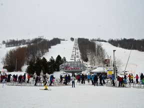 Skiers and boarders ride up the Silver Bullet chairlift on opening day at Blue Mountain Resort Dec. 19, before a provincial lockdown began Dec. 26.