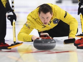 Team Manitoba skip Jason Gunnlaugson delivers while taking on Quebec at the Brier in Kingston, Ont., on Sunday, March 1, 2020. THE CANADIAN PRESS file photo/Sean Kilpatrick