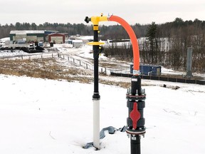 A new landfill gas collection well recently installed at OVWRC. A total of 40 wells are installed at the landfill to draw methane gas from finished areas of the landfill that have reached final contours. The enclosed flare and gas extraction plant is shown to the right in the above picture with the centre's main buildings to the left.