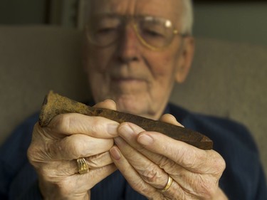 Ed Muldoon, who was 15 when he survived the Almonte train wreck of December 1942, holds a railway spike he picked up at the site of the crash. Since the accident he's suffered repeated nightmares.