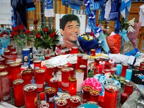 General view of tributes left for Diego Maradona outside the stadium before the match between Napoli and AS Roma at Stadio San Paolo in Naples, Italy on Nov. 29. The Argentine football star died Nov. 25.