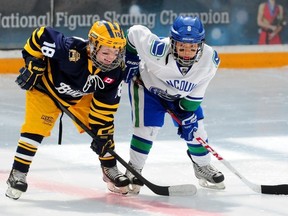 Toronto Bulldogs forward Tyler Hotson, from Stratford, and B.C. Junior Canucks forward Trevor Wong line up for the opening faceoff of the Brick Invitational Super Novice Hockey Tournament final game at West Edmonton Mall on Sunday, July 7, 2013. Seven years later, Hotson has committed to Division 1 RPI.