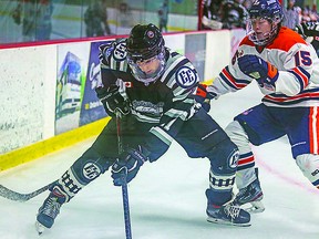 NOJHL SAULT BOYS Cole Delarosbil (left) of the Espanola Express and Connor Toms of the Soo Thunderbirds vie for puck possession during a recent Northern Ontario Jr. Hockey League game at the Espanola Regional Recreation Complex. The Express edged the Thunderbirds by a 4-3 score. CHELSEA SOLOMON