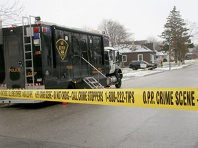 Police tape cordons off the scene after Wade Vanderwal, 44, was shot and killed by OPP officers in a December 2019 incident on Simcoe Street in Exeter. (Files)