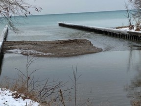 Sand buildup where Cow Creek meets Lake Huron is pictured Dec. 27. The buildup has caused water levels to rise in the creek, a neighbour says. (Submitted)