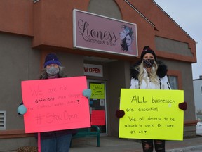 Lioness Lashes and Brows owner, Aryl Plitt, right and her mother Vicki Plitt, left, want to see the beauty salon industry treated fairly during the pandemic. They were out Sunday afternoon for a peaceful protest to give small businesses, particularly those in the beauty salon industry, a voice. Kristine Jean
