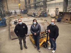 Carriere Industrial Supply general manager Mickey Obradovich, left, president Wendy Lauzon and controller Dale Alexander stand in the shop area in Lively on Thursday. The company received FedNor funding of $463,587 to purchase and install specialized equipment and robotics technology.