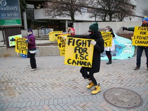 Climate activist Sophia Mathur, middle, of Fridays For Future Greater Sudbury, leads a dance with supports and Sudbury MPP Jamie West at the corner of Brady Street and Paris Street in Sudbury, Ont. on Friday December 11, 2020. The event was held to mark #FightFor1Point5 Global Day of Action in the fifth anniversary of the Paris Agreement. The agreement is a legally binding international treaty on climate change.