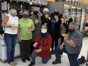 Alta Campbell, Bernie Houle, Susan Kryzanowski, Rita Brown, Danielle Kryzanowski, Sofia Walli and Theresa Land of the Espanola Helping Hands Food Bank accept a donation of over $1,000 in gift cards from Giant Tiger store owner Greg Kelso in November.