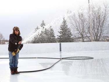 Joe Caridade floods the rink at Robinson Playground in Sudbury, Ont. on Wednesday December 16, 2020. Caridade has been taking care of the ice surface at the playground for more than 35 years. John Lappa/Sudbury Star/Postmedia Network