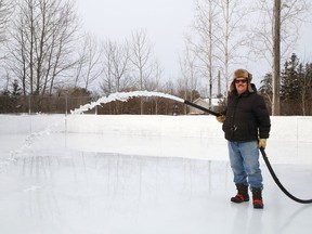 Joe Caridade floods the rink at Robinson Playground in Sudbury, Ont. on Wednesday December 16, 2020. Caridade has been taking care of the ice surface at the playground for more than 35 years