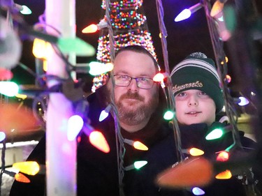 Michael Serafini and his son, Nathan, 8, check out the Sudbury Charities Foundation Festival of Lights at Science North in Sudbury, Ont. on Friday December 18, 2020. John Lappa/Sudbury Star/Postmedia Network