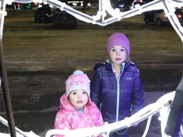 Harper and Avery Phillips check out the Sudbury Charities Foundation Festival of Lights at Science North in Sudbury, Ont. on Friday December 18, 2020. John Lappa/Sudbury Star/Postmedia Network