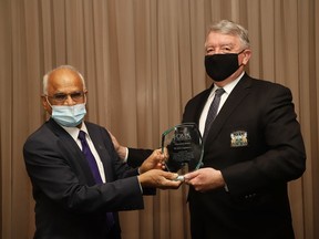 Dr. Rayudu Koka, left, president of the Sudbury and District Medical Association, presents Gerry Lougheed with the Ontario Medical Association Centennial Award on Tuesday. The award is in "honour of outstanding achievements through lengthy service and/or distinguished acts in serving the health and welfare of the people of Ontario," according to a release. Koka said he nominated Lougheed for the award because of his many contributions to local health capital projects and the establishment of bursaries, including the construction of the cancer centre, the single site hospital, St. Joseph's Villa, the hospice, the assisted living building at Finlandia Village, as well as the NOSM bursary program.