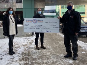 HSN Foundation manager Rosie Graffi, left, and Anthony Keating, president of Foundations and Volunteer Groups at HSN, accept a cheque from Al Hooper, Work Centre manager with Ontario Power Generation.