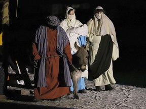 A shepherd with donkey leads Joseph and Mary, with baby Jesus, through a scene in the Living Nativity at All Nations Church. Churches across Sudbury have adapted their services this holiday season to adhere to public health guidelines and rules.