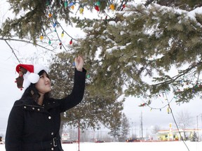 Miah-Yuan Corbeil, whose idea of a community Christmas tree was accepted by city council about five years ago, was excited to be able to participate in what has now become a traditional tree lighting ceremony in Hollinger Park. The tree was lit up on Wednesday night.

RICHA BHOSALE/The Daily Press