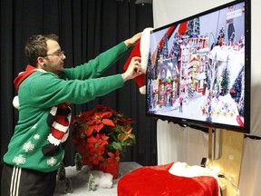 Mason Charbonneau, a science communicator with Science Timmins, was setting up the I-Santa event section at the Science Village on Wednesday. The event will provide youngsters a chance to meet Santa Claus virtually this Sunday.

RICHA BHOSALE/The Daily Press