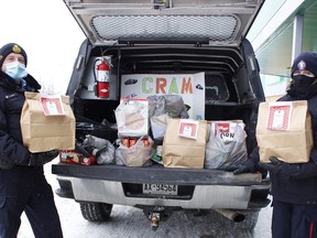 OPP Auxiliary Staff Sgt. Rick Audette and Timmins Police Service Auxiliary Const. Heather Albert were outside Food Basics on Saturday collecting cash donations and non-perishable food items during the annual Cram-a-Cruiser food drive.

RICHA BHOSALE/The Daily Press
