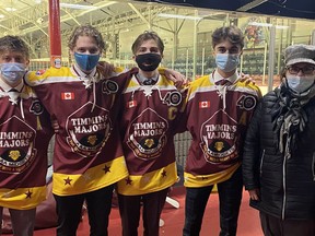 Members of the Timmins Majors collected $510 and donated it to the North Eastern Ontario Family and Children's Services after their games on Sunday at the McIntyre Arena. From left, Majors players Nolan Ring, Chase Longhurst, Pierre Racicot and Justin Charette, are joined by Carole Hart of NEOFACS. 

Supplied