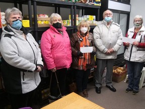 With the closing of the Delhi Township Senior Citizens Club, a painful decision made by the club's board of directors in September due to declining membership and rising membership ages, club funds needed to be dispersed. Last Thursday, a $6,000 cheque was presented to the Delhi Sharing Pantry and a $1,000 cheque to the Delhi and District Horticultural Society. From left Mary DeRick and Dianne Ferrell, Township of Delhi Senior Citizens Club Inc., Donna Koncir, Delhi and District Horticultural Society, Dennis Tyrrell, of the Township of Delhi Senior Citizens Club Inc., and Ruth Brown, co-coordinator of the Delhi Sharing Pantry. (Chris Abbott/Norfolk & Tillsonburg News)