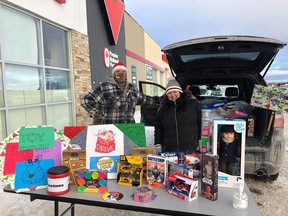 Bruce Nelson and Kayla Lariviere accepted donations at Canadian Tire during Ininew's Annual Toy Drive.